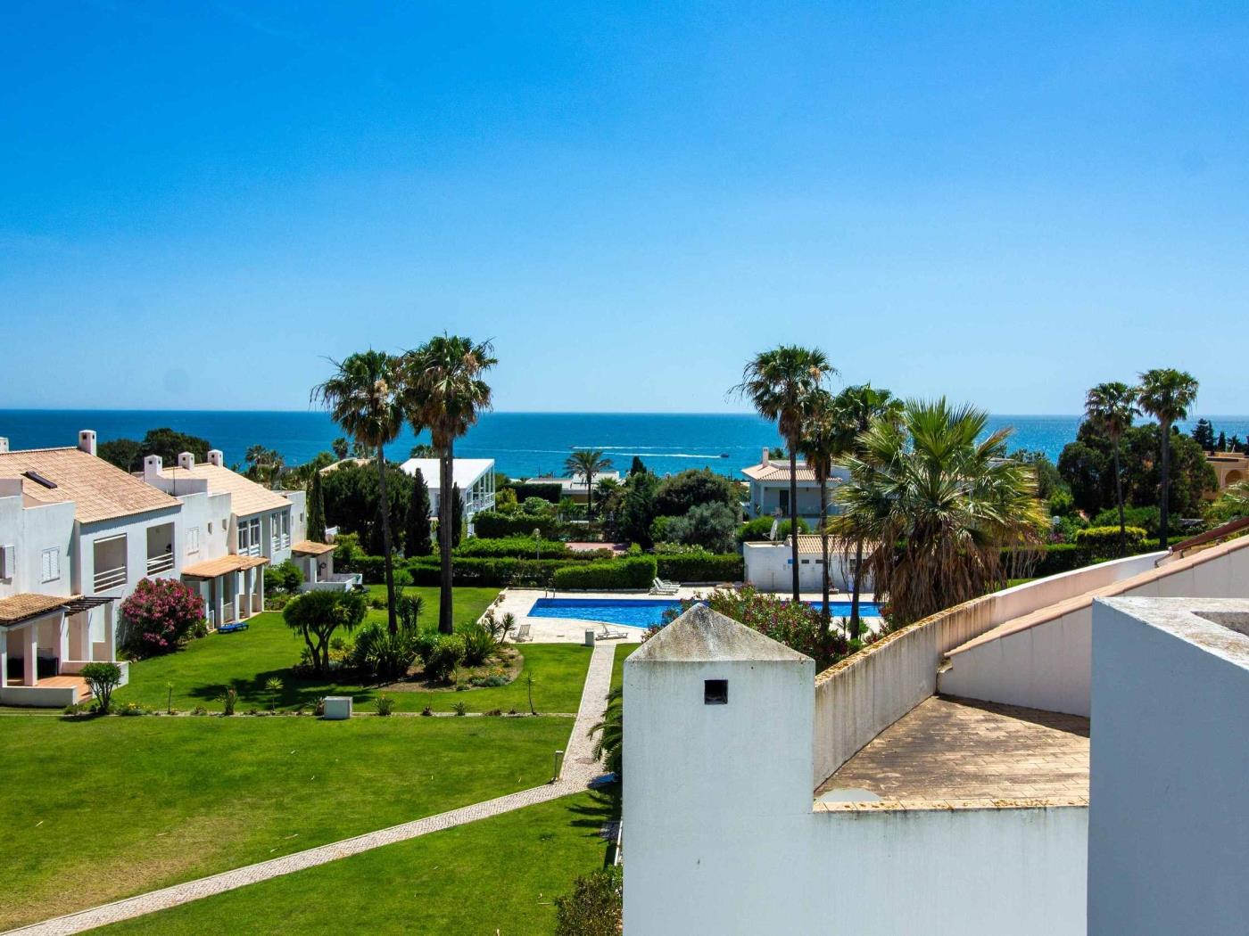 Shared pool, gardens and Atlantic view from Dunas Salgados Apartment