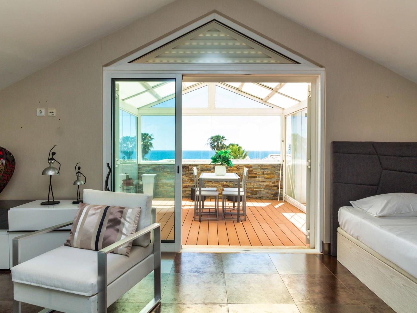 Upper-floor suite opening to the sea-view terrace at Dunas Salgados Apartment